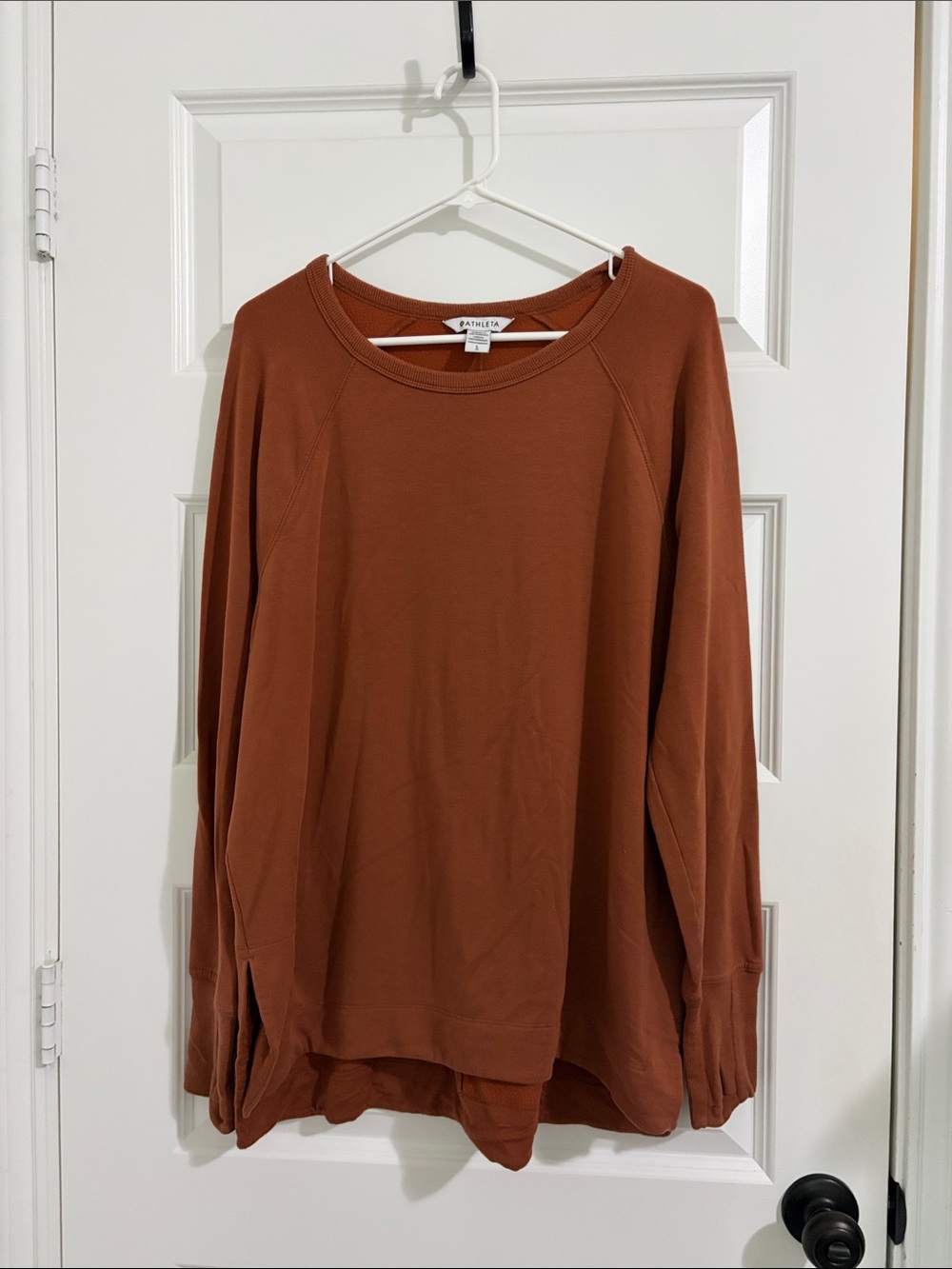 Athleta pullover sweatshirt crewneck with thumb holes and sides slits. Size L